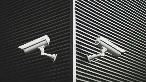 two grey CCTV cameras